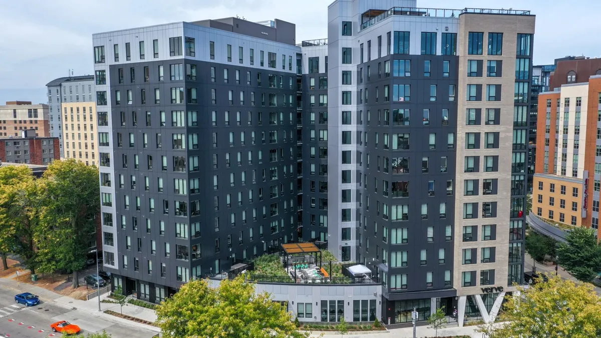 Tall, multi-colored high rise apartments.