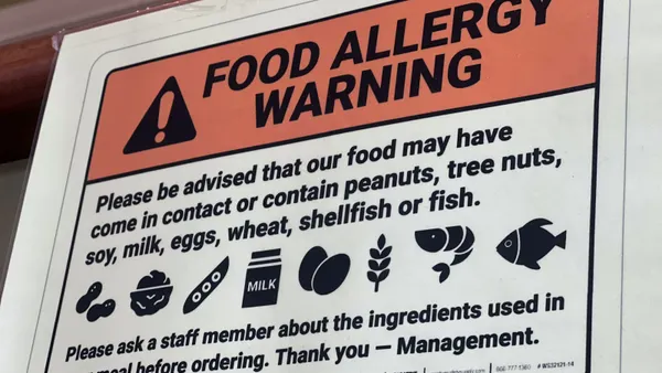A sign that indicates food allergy warnings.