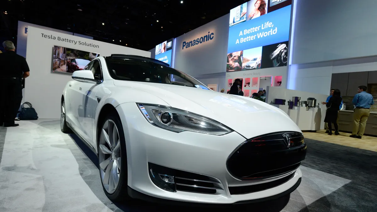 A Tesla electric car is on display at the Panasonic booth at the 2014 International CES at the Las Vegas Convention Center on January 7, 2014 in Las Vegas, Nevada.