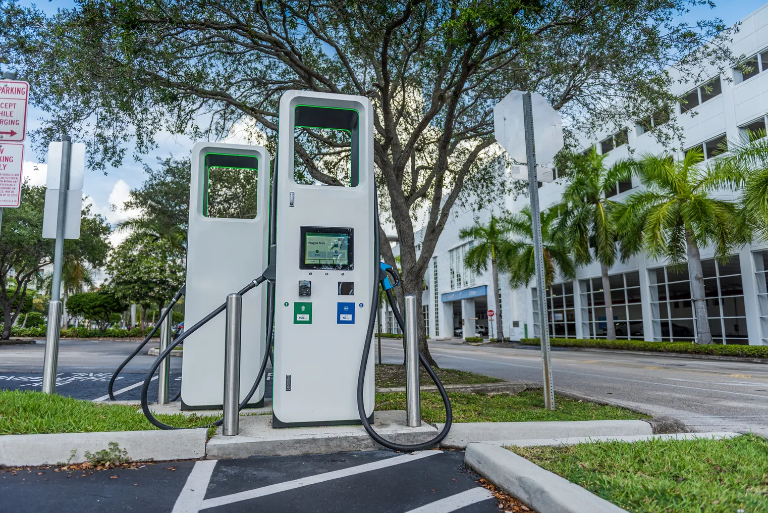 An EV charging station in an office building parking lot.