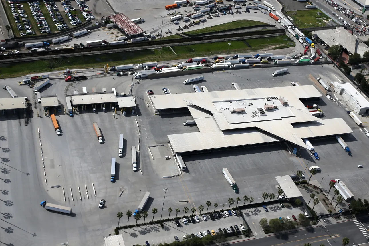 Commercial freight trucks line up to cross into the United States from Mexico through the U.S. Customs and Border Protection - Otay Mesa Port of Entry.