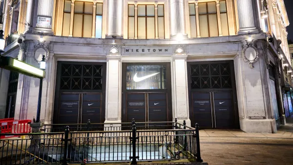 A Nike storefront at night in London.