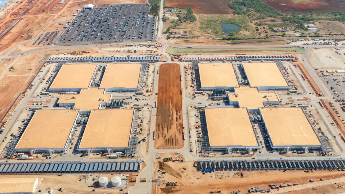 A large data center campus under construction in a desert