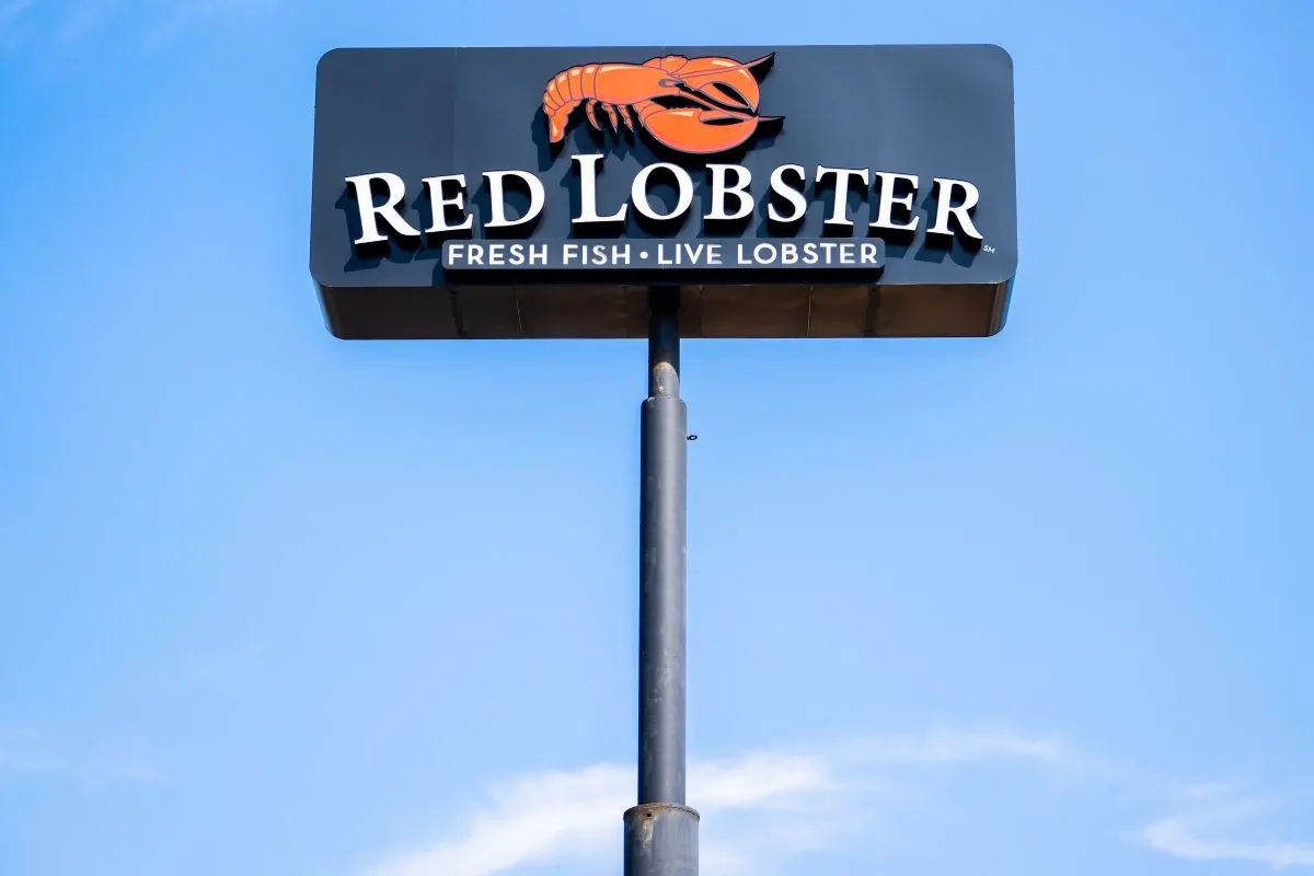 An image of a rectangular blue sign with a lobster and Red Lobster signage