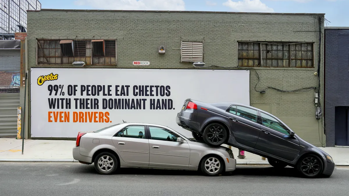 OOH imagery for Cheetos' "Other Hand" campaign.