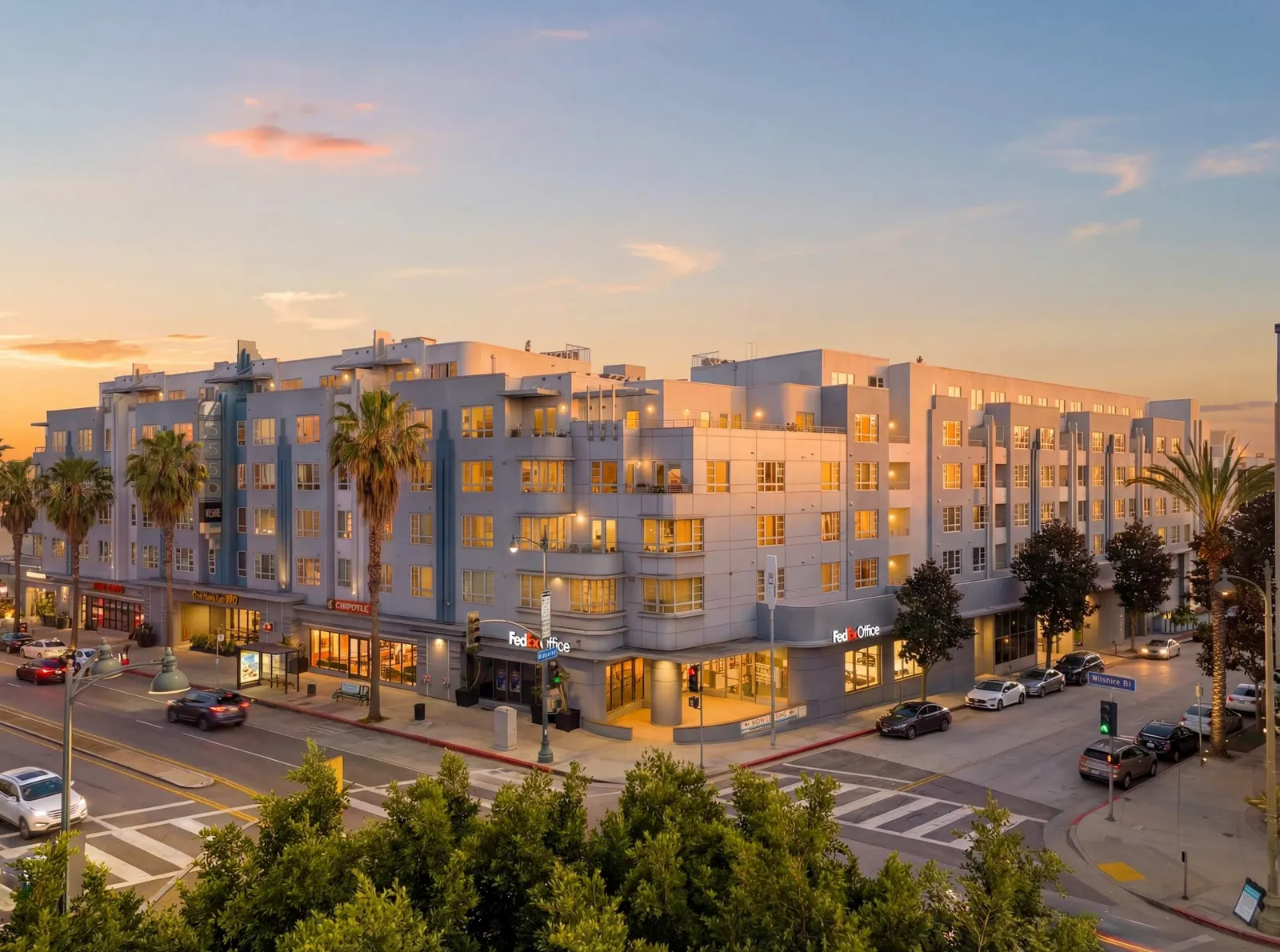 Mid-rise apartment building on a street corner.