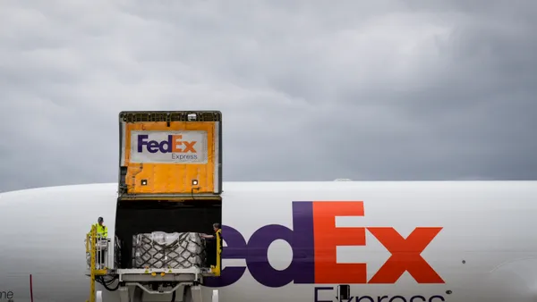 Pallets of baby formula are unloaded from a FedEx cargo plane upon arrival at Dulles International Airport on May 25, 2022, from Ramstein Air Base in Germany.