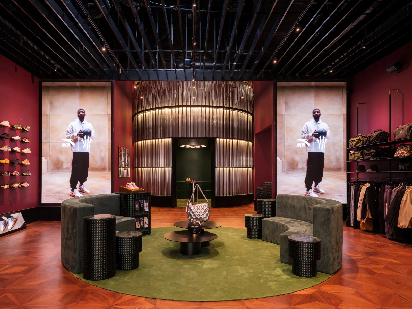 An Anta store displaying footwear and apparel alongside imagery of NBA player Kyrie Irving.