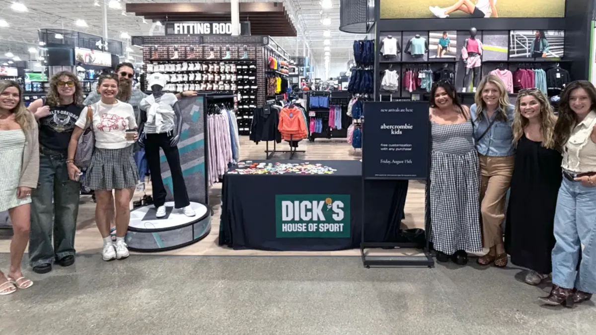 A group of people in Dick's Sporting Goods in support of the new Abercrombie Kids wholesale partnership.