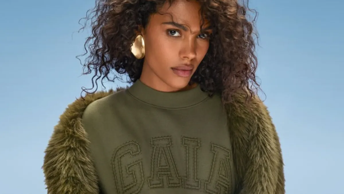 A model wears a Gaia-branded sweatshirt from the Gap and Cult Gaia collaboration.