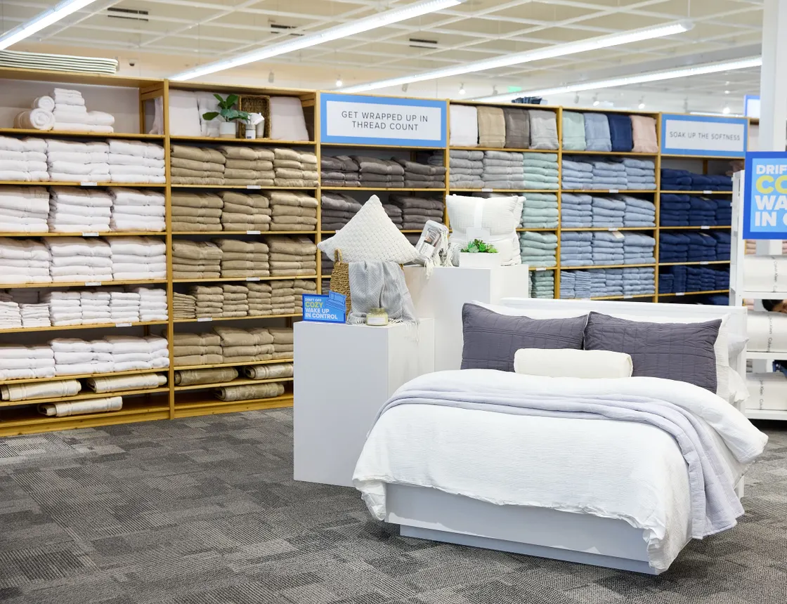 A bedding display within the co-branded Bed Bath &amp; Beyond / The Container Store concept