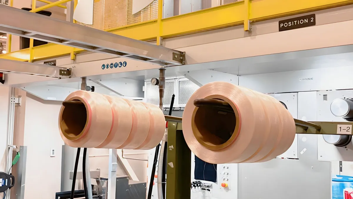 Rolls of finished filament yarn in the Fiber Spinning Lab at The Nonwovens Institute, NC State University.