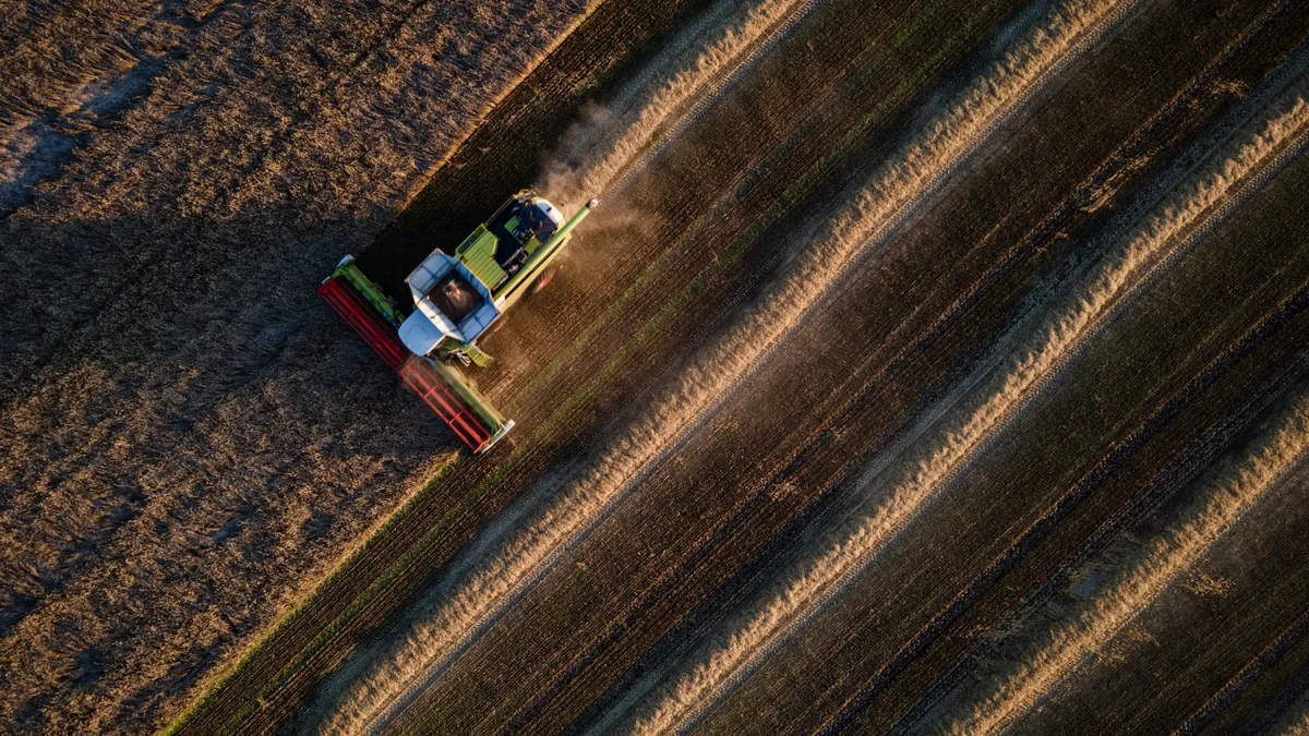 A combine harvester harvests a wheat field near Kyiv, Ukraine.