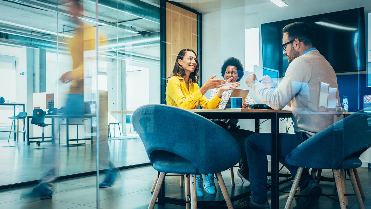 Workers in a collaborative conference room.