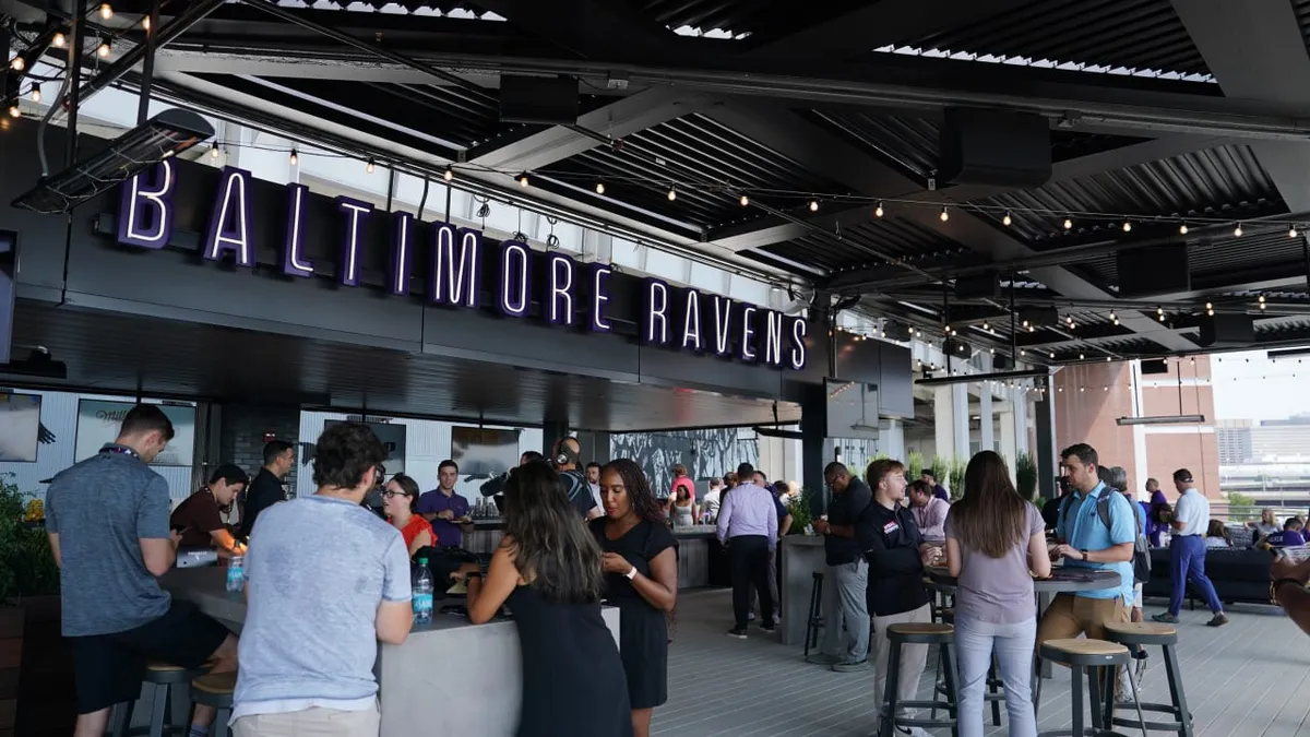 Fans socialize on the new rooftop deck at M&T Bank Stadium in Baltimore.