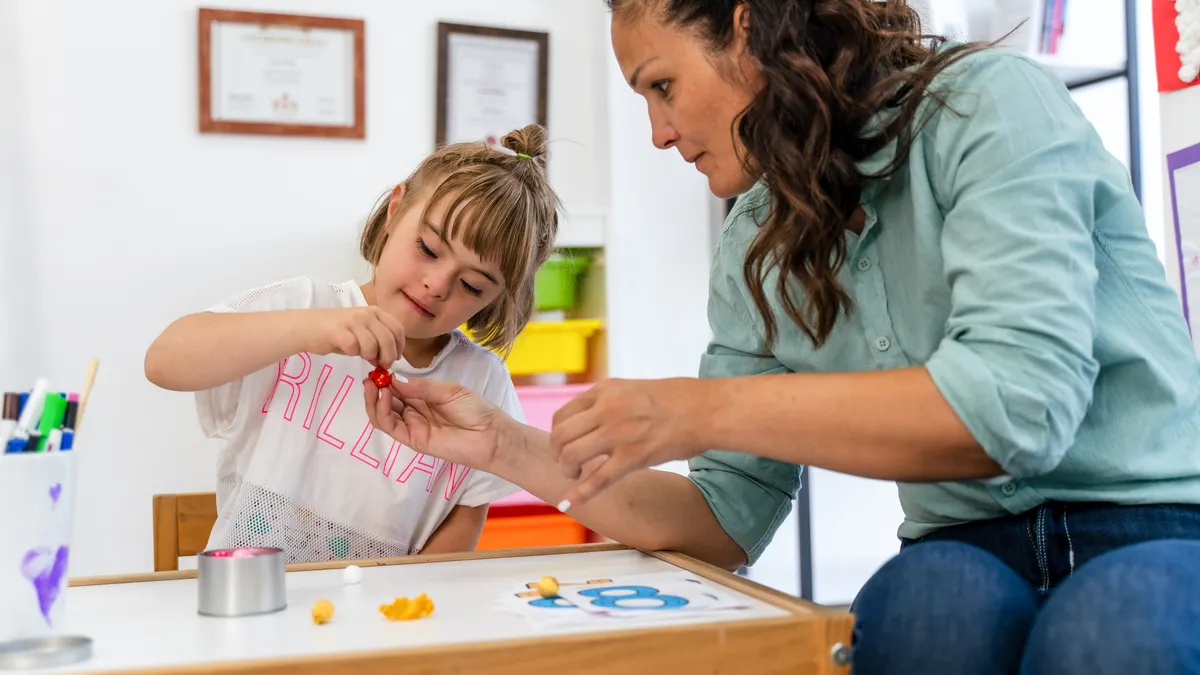 Child with down syndrome learn numbers.