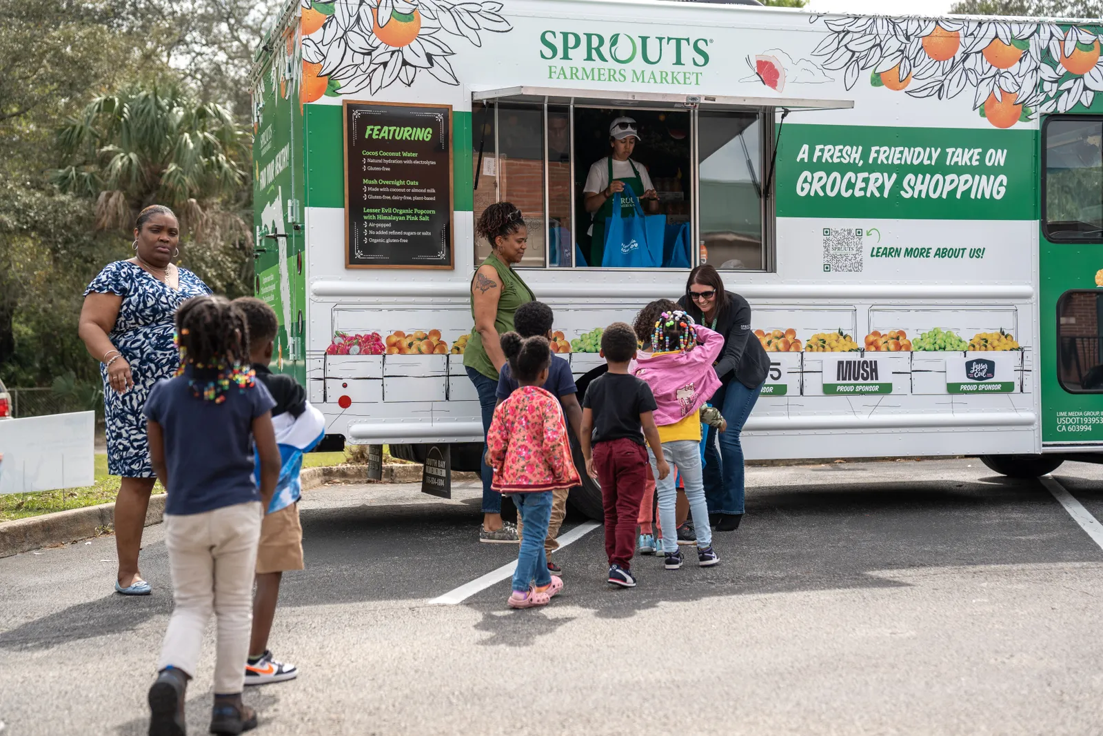 Children approaching Sprouts Mobile Truck