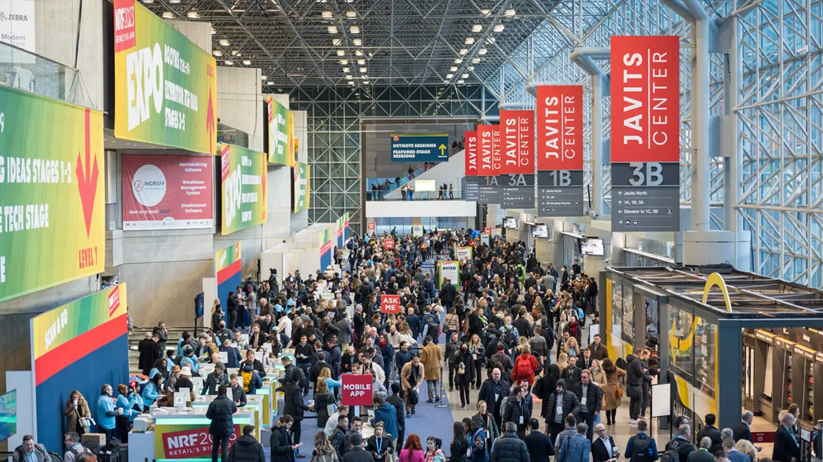 View from above of a conference center filled with people.