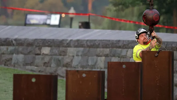 A worker tests an emergency levee.