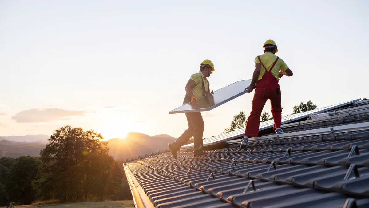 Installation of solar panels on a roof.