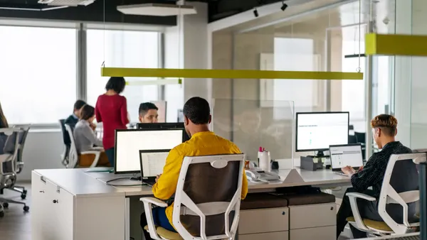 People working in coworking office space