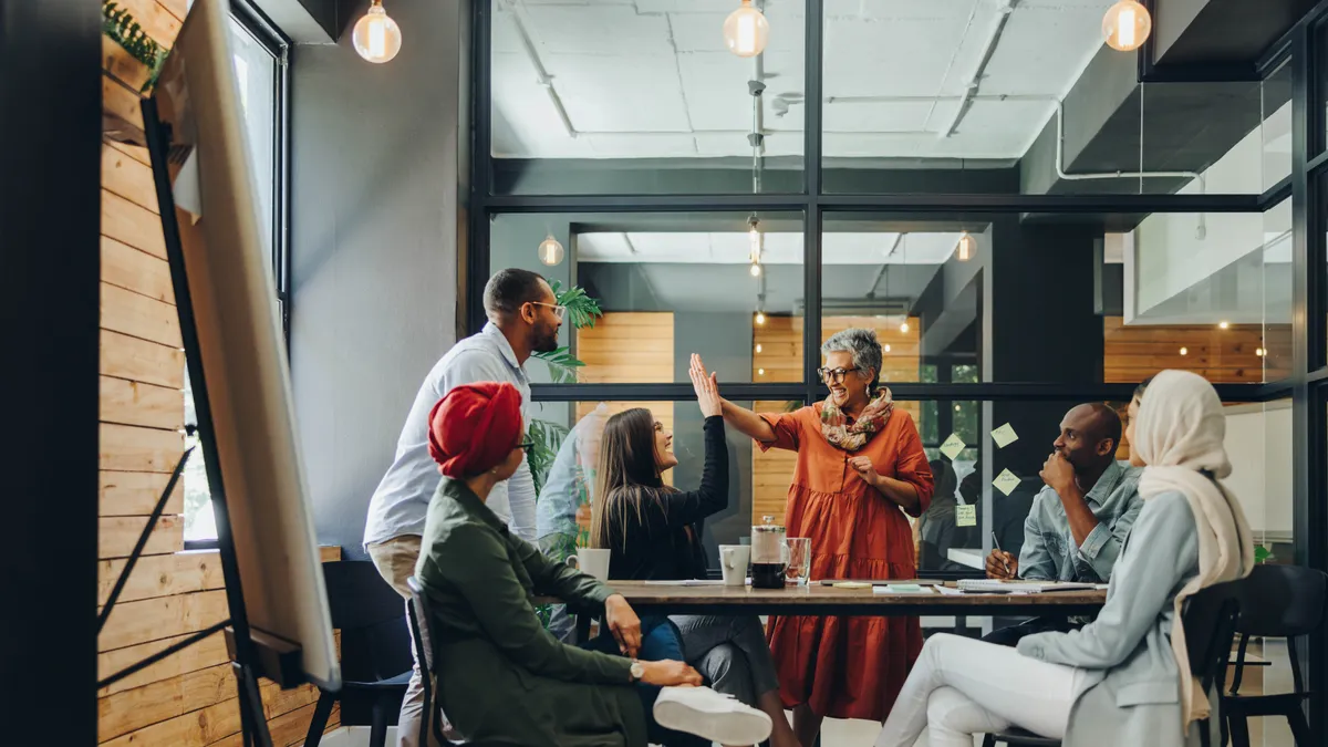 People talk during a business meeting.