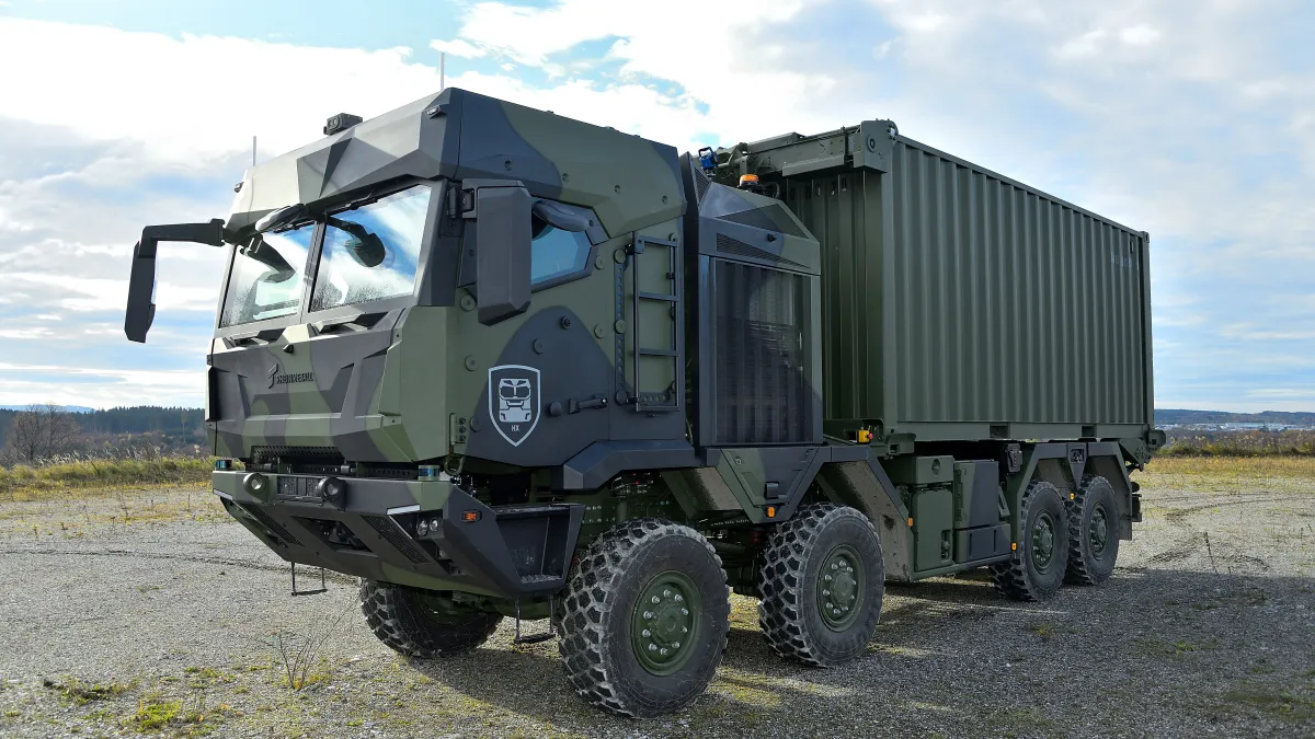 A heavy tactical vehicle out in the sun.