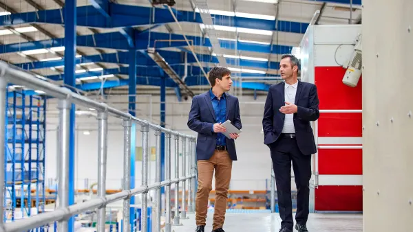 Two men consulting in a factory