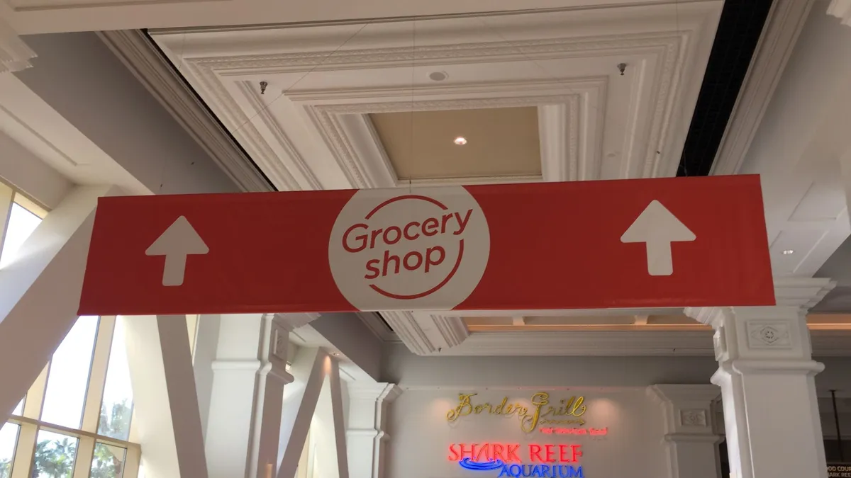 Red sign with the word "Groceryshop"