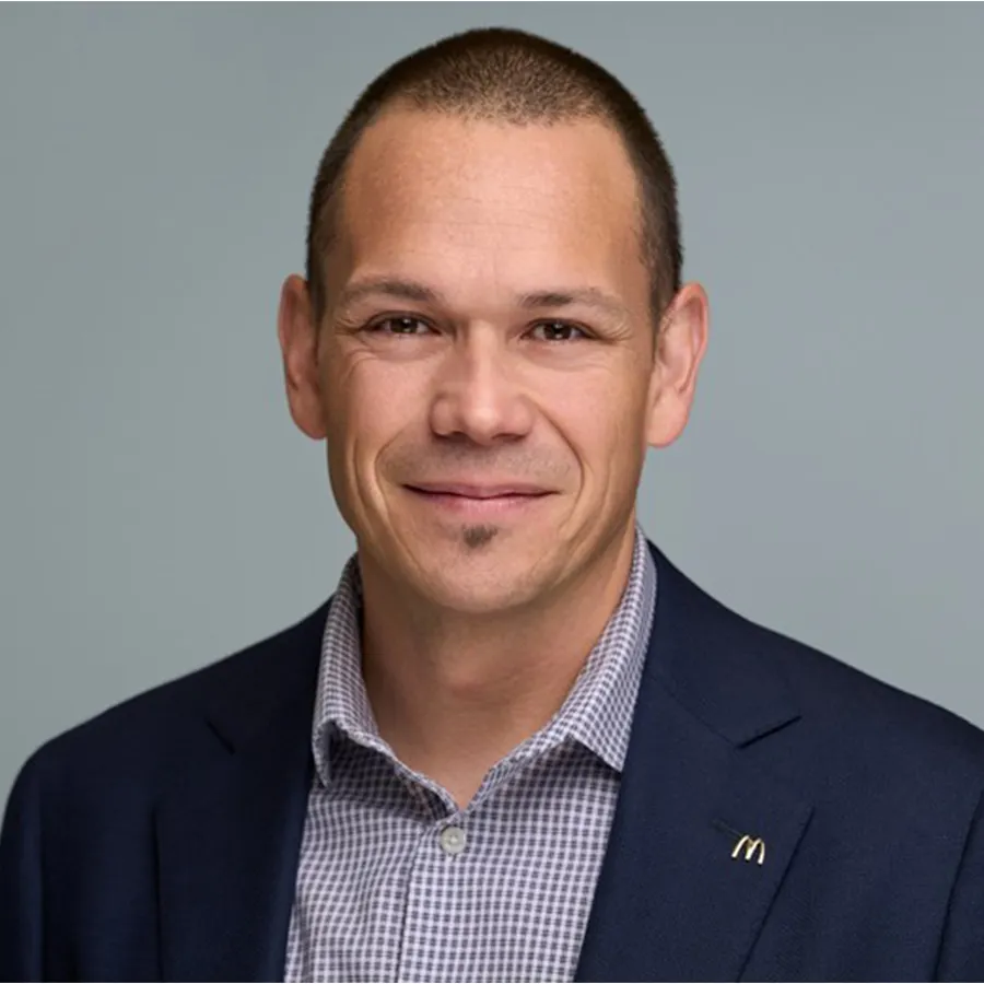 A photograph of a person wearing a suit.