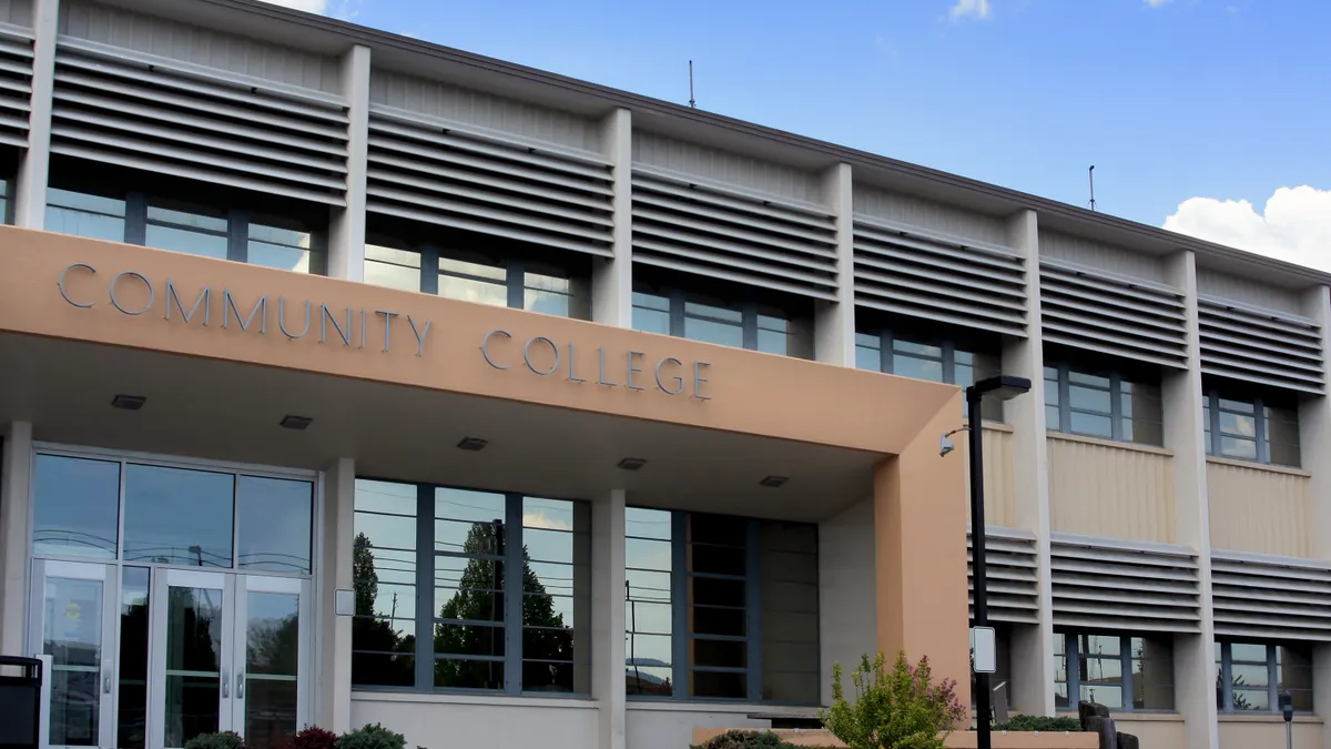 A building bears a sign that says "community college."