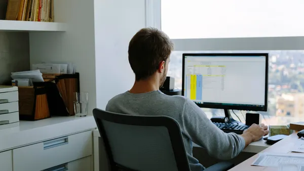 working on computer in office