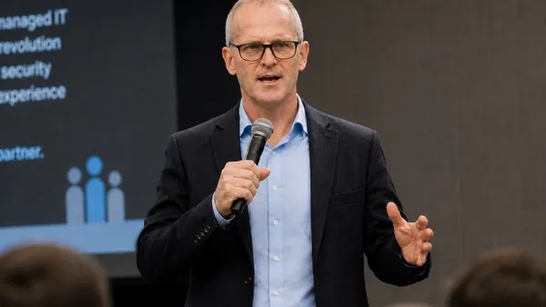 A man with a microphone speaking