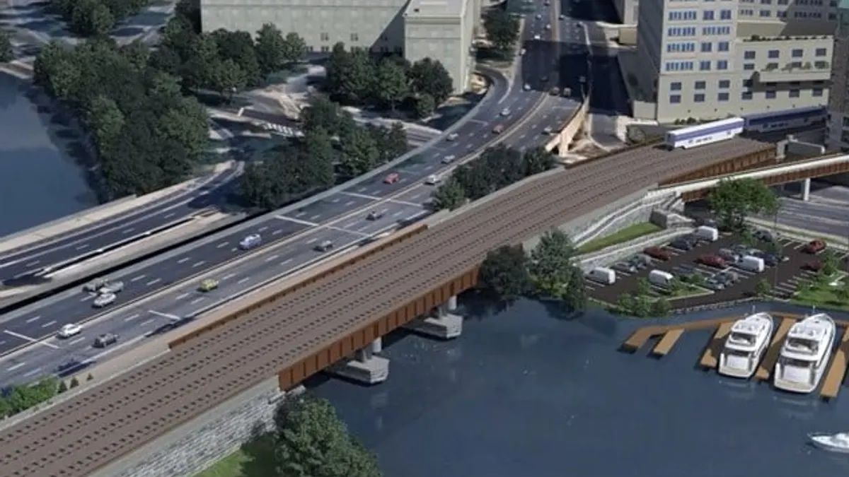 A rendering shows plans for the construction of a rail bridge over a river from above.