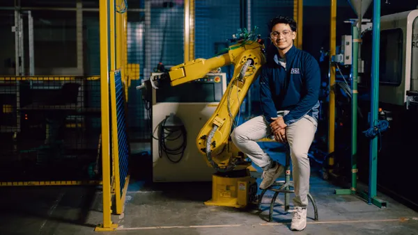 Kettering student sitting in manufacturing room