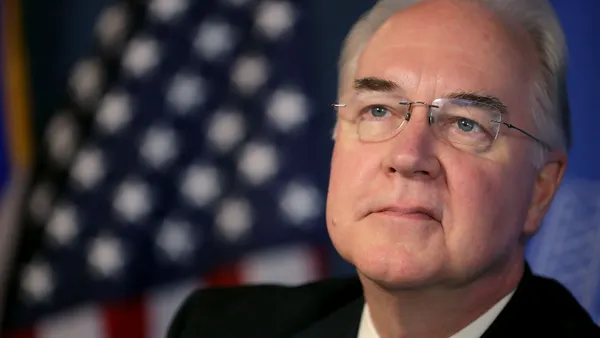 Tom Price in front of the American flag.