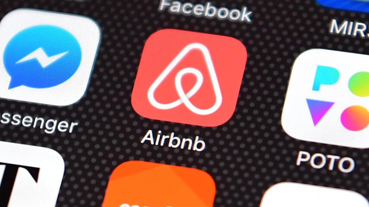 AIrbnb logo displayed on a phone