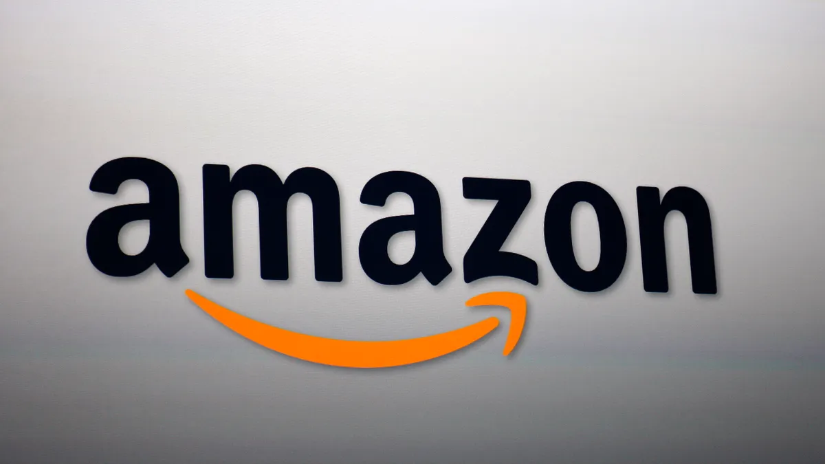 The Amazon logo is projected onto a screen,