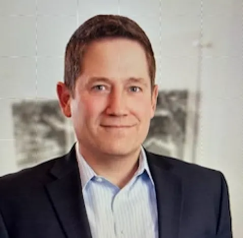 A headshot shows construction attorney Reed Hauptman, a partner at law firm Shumaker.