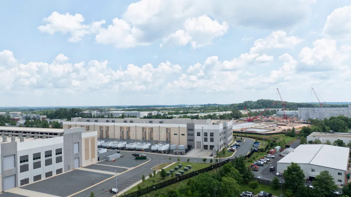 Aerial view of a data center in Sterling, Virginia and a new data center being constructed in the background.