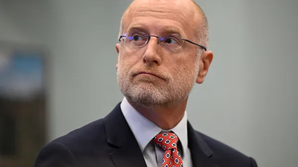 Brendan Carr looks to the left during his first appearance at a Congressional hearing.