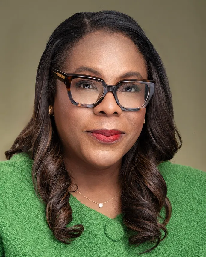 Headshot of a woman in business attire.