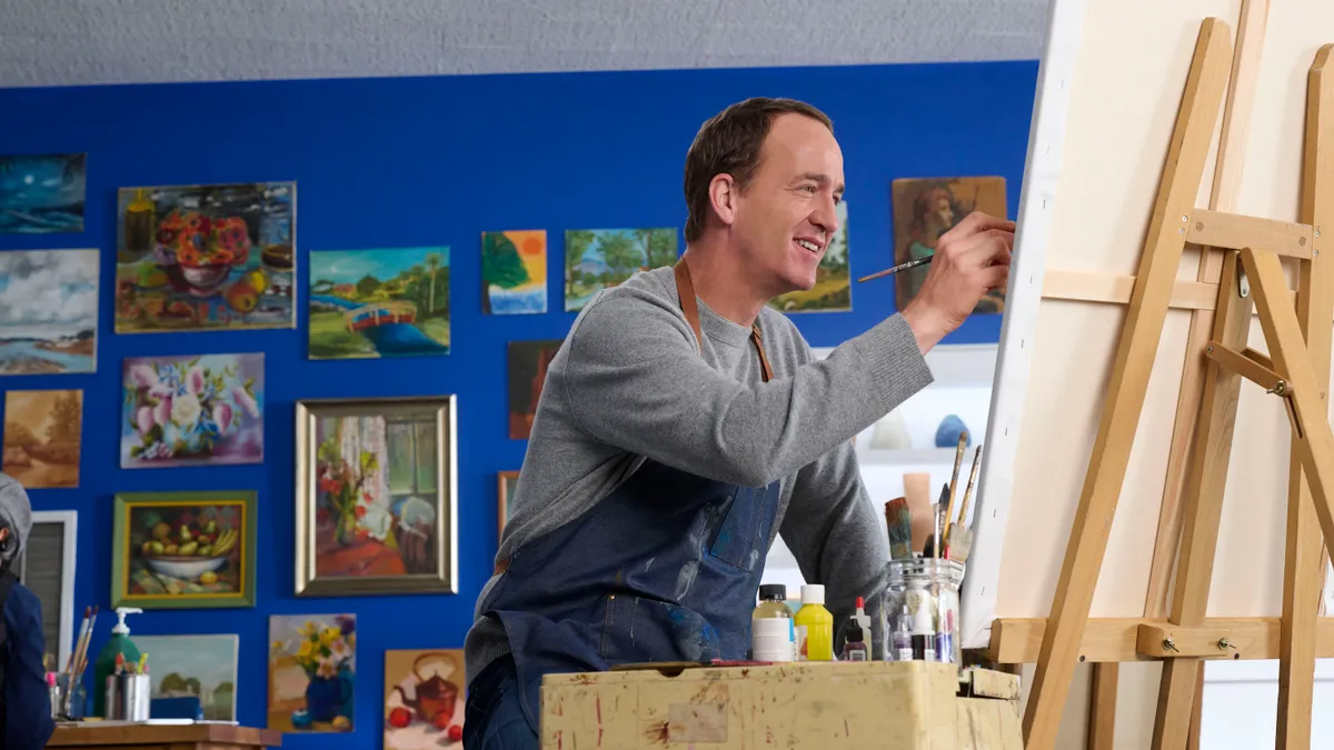 Peyton Manning painting in a Nationwide ad