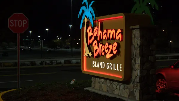 A night image of a sign that says Bahama Breeze
