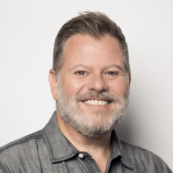 A professional headshot.