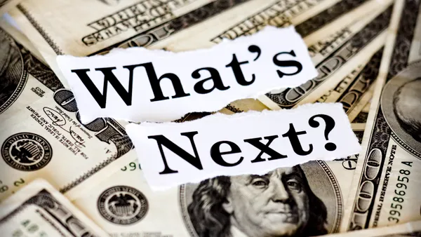 Uncertainty expressed by "What's Next" text superimposed on $100 bills