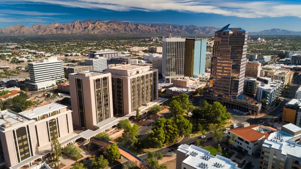 An aerial view of a city with some arid mountains in the background.
