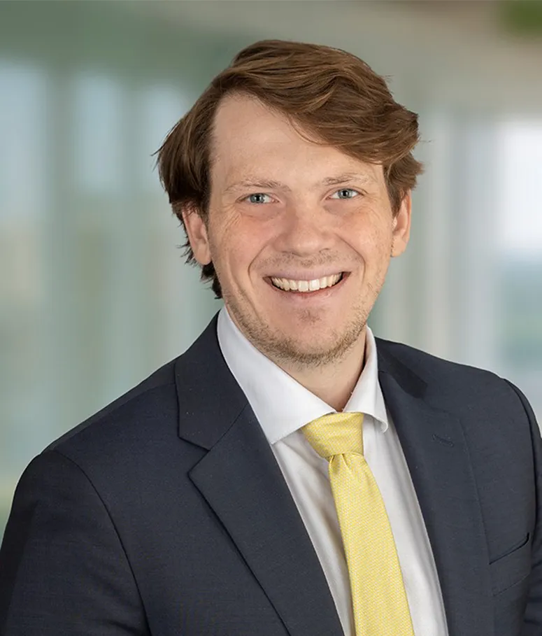 This is a headshot of Will Barker, an associate attorney in Raleigh who concentrates on intellectual property transactions.