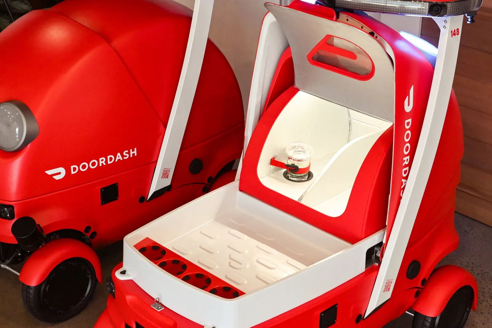 A red robot from DoorDash called Dot.