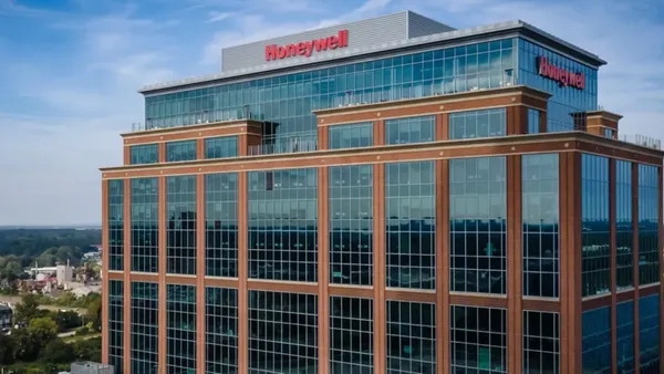 The top half of a building with the red Honeywell sign at the top.